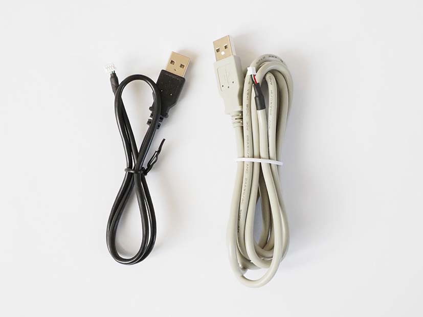 USB cables in black and white as accessories for BALTECH RFID readers