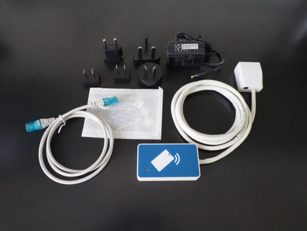 Ethernet Card Reader for Print Management, used to be exclusively distributed by Kofax, now in direct sales at BALTECH: reader, Ethernet cable, velcro tape, Plug-in power supply int. with various plug attachments
